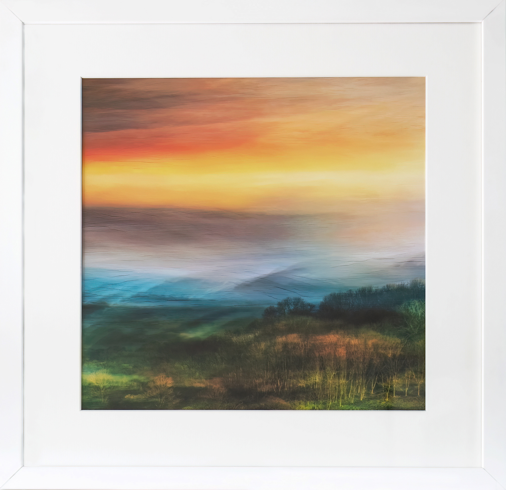 Dawn Mists is a framed, atmospheric fine art photographic print of Dawn mists and the sunrise colours over the hills at Symondsbury in Dorset