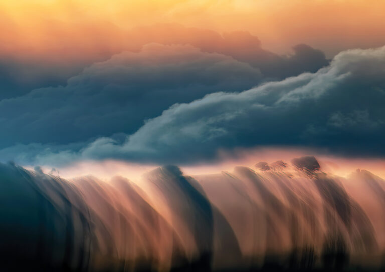 Where Land Meets Sky is a dramatic contemporary landscape of Dawn Light and mists rolling over the hills and ridge of trees at Symondsbury in Dorset. Dorset fine art photographer.